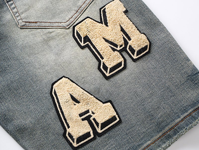 AMIRI Light Blue Letter Patch Denim Shorts — detail